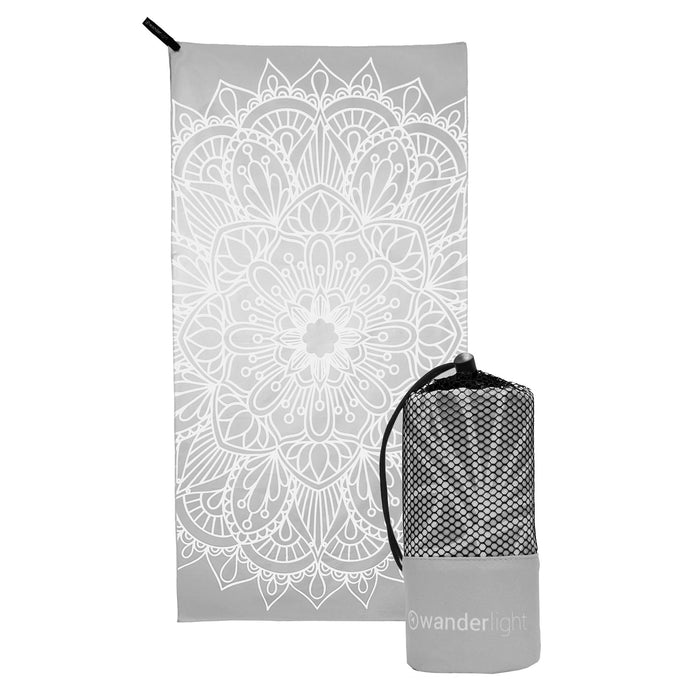 grey towel with large white mandala print, hang loop on upper left corner and branded grey carrying pouch