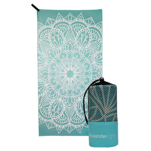 turquoise towel with large white mandala print, hang loop on upper left corner and branded turquoise carrying pouch